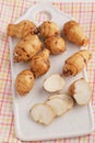 Jerusalem artichokes on a cutting board Royalty Free Stock Photo