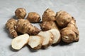 Jerusalem artichokes on light grey marble table, closeup Royalty Free Stock Photo