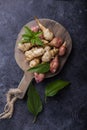 Jerusalem artichokes or topinambour, topinambur, also known as earth apple or sunroot on a cutting board. Dietaryfibre