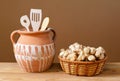 Jerusalem artichokes in wicker baskets with wooden kitchen utensils