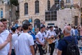 Jerusalem, Israel - 10 April, 2023. Bar Mitzvah, Jewish coming of age ancient ritual for boys Procession with, happy parents,