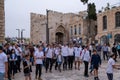 Jerusalem, Israel - 10 April, 2023. Bar Mitzvah, Jewish coming of age ancient ritual for boys Procession with, happy parents,