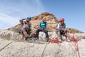 Experienced athletes rest before the descent with the equipment for snapping in the mountains of the Judean Desert near the