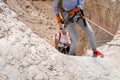 Experienced athletes start the descent with the equipment for snapping in the mountains of the Judean Desert near the Tamarim