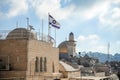 The Israeli flag against the backdrop of the Al Aksa mosque in the Jewish quarter in the old city of Jerusalem near the Western Wa Royalty Free Stock Photo