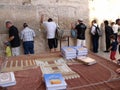 Jewish holy books with people praying at the Wailing Wall in the city of Jerusalem, Israel