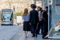 Jerusalem, Israel- August 17, 2016: Jewish Orthodox man and woman waiting for the train in Jerusalem, Israel