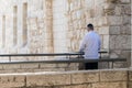 A religious prays at sunrise in the Jewish quarter in the ol