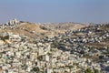 Jerusalem, Israel - August 2019: Small village and the Israeli West Bank barrier or wall - separation barrier on the West Bank in Royalty Free Stock Photo