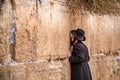 11/23/2018 Jerusalem, Israel, Believing is praying near the wall of crying in a big black hat