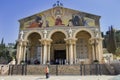 Church of All Nations in Jerusalem with pilgrims and tourists, view from the front.