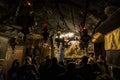 A group of believers holds a joint prayer in the Christmas Cave in the Church of Nativity in Bethlehem in Palestine Royalty Free Stock Photo