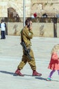 JERUSALEM, ISRAEL - FEBRUARY 17, 2013: Armed young soldier speak