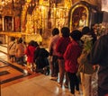 JERUSALEM, ISRAEL - FEBRUARY 17, 2013: Pilgrims praying near Golgotha Mountain in Temple of Holy Sepulchre Royalty Free Stock Photo