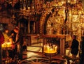 JERUSALEM, ISRAEL - FEBRUARY 17, 2013: Pilgrims praying near Golgotha Mountain in Temple of Holy Sepulchre Royalty Free Stock Photo