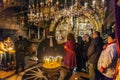 JERUSALEM, ISRAEL - FEBRUARY 16, 2013: Pilgrims praying near Golgotha Mountain in Temple of Holy Sepulchre Royalty Free Stock Photo