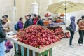 JERUSALEM, ISRAEL - FEBRUARY 16, 2013: Tourists buying strawberry on the streets of city