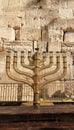 The huge traditional and state-owned menorah in the Western Wall plaza