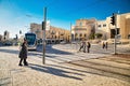 Central square, administrative buildings, large houses, few people, sunny day