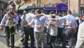 Jewish men celebrate Simchat Torah.