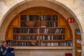 23/11/2016 Jerusalem, Israel, Jews sit near shelves with religious books on the square