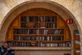 23/11/2016 Jerusalem, Israel, Jews sit near shelves with religious books on the square