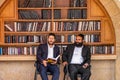 23/11/2016 Jerusalem, Israel, Jews sit near shelves with religious books on the square