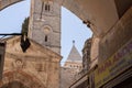 View through the arch of the Arabian market to the bell tower of the Church of the Redeemer and the minaret of the Omar Mosque in Royalty Free Stock Photo