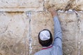 Jerusalem Israel, leave the letter with a prayer. Tourist puts a letter with a request to God in the gap in the