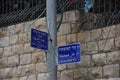 Jerusalem Israel 27 March 2021, blue plaques on the pillar with street names in three languages, English, Arabic ,Hebrew