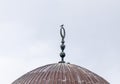 A crow sits on a Muslim symbol at the top of Al Aqsa Mosque on the Temple Mount in the Old Town of Jerusalem in Israel
