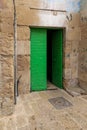 Metal old wooden door of a residential building, bound with iron, in the old city of Jerusalem, Israel