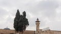 Part of the Western Wall with the Al Aqsa Mosque visible above it and the Minaret over the Islamic Museum in the Old Town of
