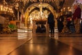 Praying women in the Church of the Holy Sepulcher. Blurred background