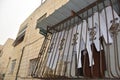 Jerusalem Israel 27 March 2021, residential building balcony with bars and awning, white pants and towels air drying