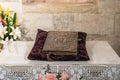 The sacred book lies on a pillow in the prayer room in the cave in the Church of Saint Anne near Pools of Bethesda in the old city