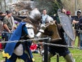 Two knights with shields and swords fight in the ring at the Purim festival with King Arthur in the city of Jerusalem, Israel