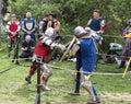 Two knights with shields and swords fight in the ring at the Purim festival with King Arthur in the city of Jerusalem, Israel