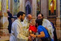 Greek Orthodox Patriarch performs Holy Communion Eucharist, Holy Sepulchre church