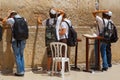 Young men prays by The Western Wall in Jerusalem