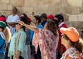 Believer lifts her hands to heaven during group prayer in the courtyard of the Chapel of the Ascension on Mount Eleon - Mount of