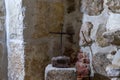 A metal cross symbolizing a crucifix in an altar in the basement of St. Mark`s Church - The Syrian Orthodox Church in old city of