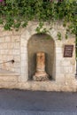 A niche in the wall with a broken column opposite the entrance to the Church of Mary Magdalene in Jerusalem, Israel