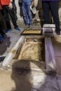 Stone with the footprint of the Foot of Christ surrounded by a marble frame in Chapel of the Ascension on Mount Eleon - Mount of