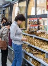 The visitor chooses a souvenir in the store located in The Garden Tomb Jerusalem located in East Jerusalem, Israel