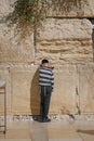 Jerusalem, Israel - October 5, 2022 :Jewish child prays in the Wailing Wall of Jerusalem