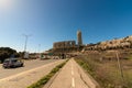 An old asphalt road for cyclists near a main road in Jerusalem, in the background of the buildings of the Holyland neighborhood Royalty Free Stock Photo