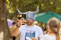 A festival goer tries on a DIY felt mask with horns at the Knights of Jerusalem Festival at the Ein Yael Museum, in Jerusalem,