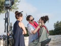 The make-up artist makes makeup for the model before shooting at Mt. Scopus in Jerusalem in Israel