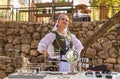 Jerusalem, Israel, September 24, 2022 : A vendor dressed in medieval clothing sells homemade jewelry at the Knights of Jerusalem